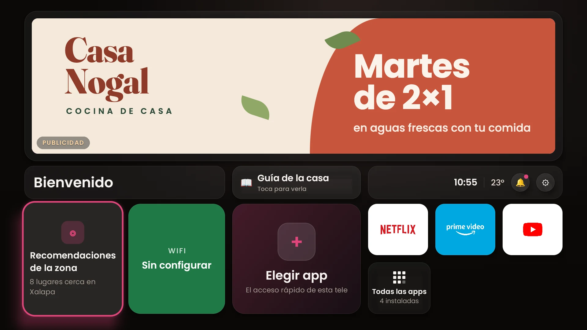 Pantalla de inicio de la tele: arriba, el carrusel con la promoción de un negocio; abajo, el acceso a Recomendaciones de la zona y a las apps.